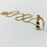 Gold necklace with handcarved blue enamel lighthouse charm