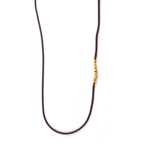 Roz Buehrlen gold chattering skull stack cord necklace
