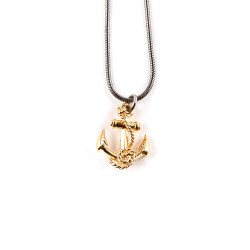 Gold anchor pendant on a ruthenium snake chain.